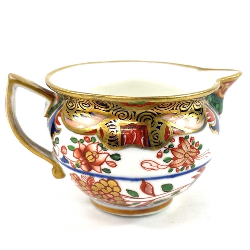 885 - A Spode porcelain chamberstick decorated with pattern 967 and highly gilt. Height 6cm together with ... 