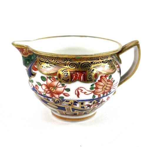 885 - A Spode porcelain chamberstick decorated with pattern 967 and highly gilt. Height 6cm together with ... 