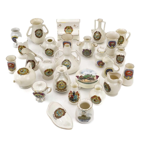 893 - Three trays of Penzance crested china. Including lighthouses, dogs and animals, pasties, boats and v... 