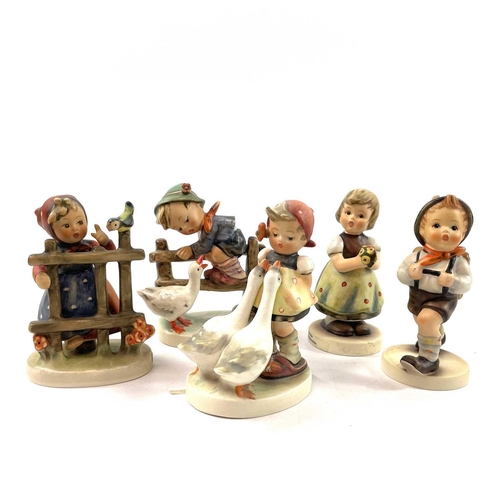 897 - A collection of fifteen Hummel porcelain figures. Including Goose Girl, The Smart Little Sister, Cud... 