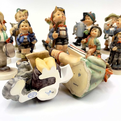 898 - A collection of seventeen Hummel porcelain figures. Including Merry Wanderer in sizes, For Father, P... 