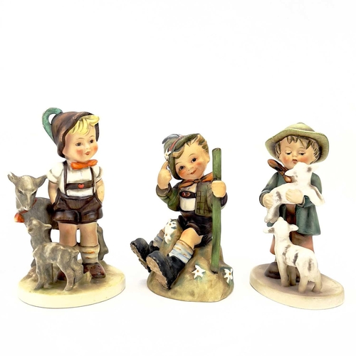 898 - A collection of seventeen Hummel porcelain figures. Including Merry Wanderer in sizes, For Father, P... 