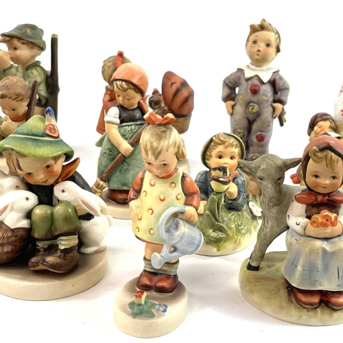 899 - A collection of seventeen Hummel porcelain figures. Including Skier, Just Dozing, Good Friends, Lazy... 