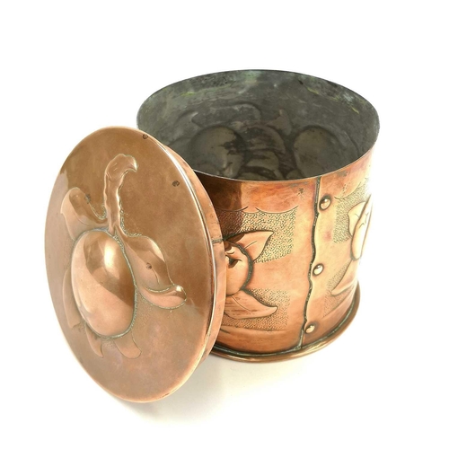 9 - A Newlyn copper cylindrical tea caddy and cover. Repousse decorated with medlars on a punched ground... 