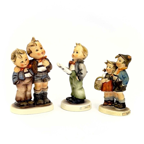 900 - A collection of twelve Hummel porcelain figures. Including Happiness, Surprise, Vocalist amongst oth... 