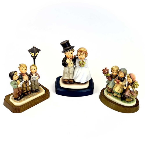 901 - A collection of ten Hummel porcelain figures. Including Camera Ready, Dearly Beloved, Umbrella Girl,... 