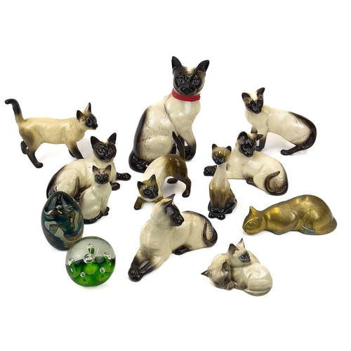 903 - Beswick pottery Siamese cats. A clowder of Beswick pottery cats, together with a brass model of a ca... 