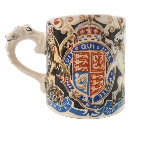 911 - A King George V coronation mug designed and modelled by Dame Laura Knight. Height 8cm together with ... 