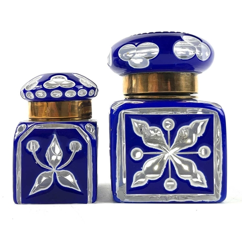 919 - A Bohemian heavy blue and white overlay glass inkwell. With hinged cover and floral and club cut dec... 