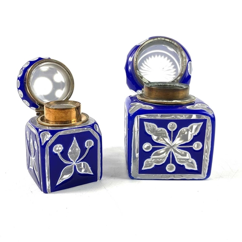 919 - A Bohemian heavy blue and white overlay glass inkwell. With hinged cover and floral and club cut dec... 