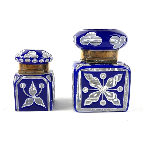 919 - A Bohemian heavy blue and white overlay glass inkwell. With hinged cover and floral and club cut dec... 