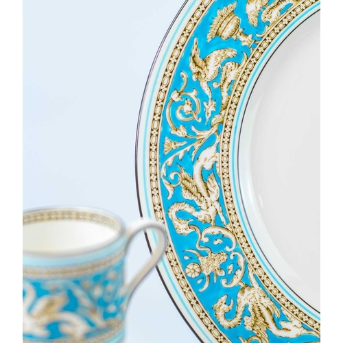 921 - A Wedgwood 'Florentine' dinner and coffee service. Comprising eight dinner plates, eight breakfast/l... 