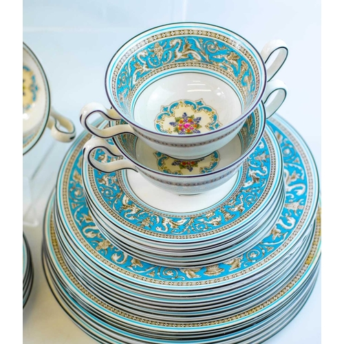 921 - A Wedgwood 'Florentine' dinner and coffee service. Comprising eight dinner plates, eight breakfast/l... 