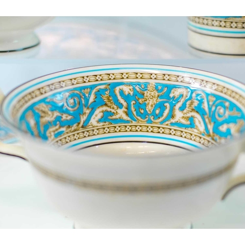 921 - A Wedgwood 'Florentine' dinner and coffee service. Comprising eight dinner plates, eight breakfast/l... 