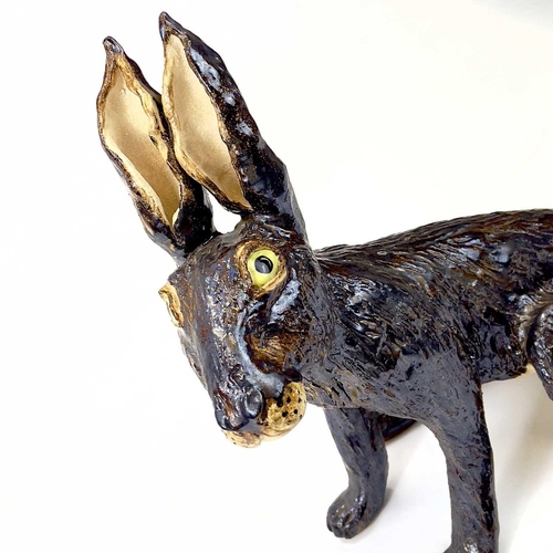 926 - Lyn DAVEY Hare Ceramic sculpture with bronze glaze Signed with initials Height 38cm, length 34cm