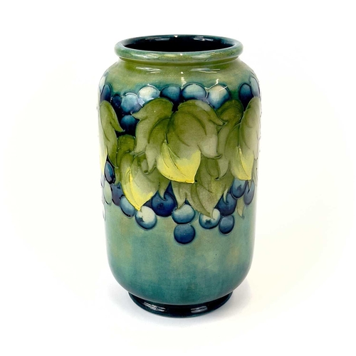 929 - A Moorcroft 'Leaf and Berry' pattern vase. Signed and impressed marks to base. Height 22cm.