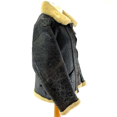 93 - A Second World War RAF black leather and sheepskin flying jacket. .