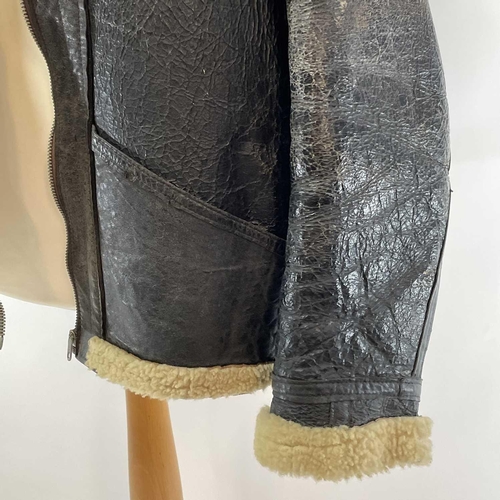 93 - A Second World War RAF black leather and sheepskin flying jacket. .