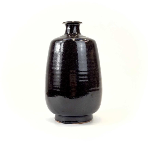 939 - A Jacob Bodilly studio pottery vase. With a tenmoku glaze, applied seal mark, height 29cm.