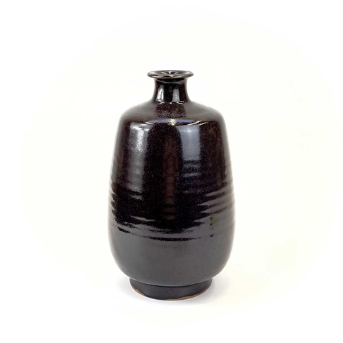 939 - A Jacob Bodilly studio pottery vase. With a tenmoku glaze, applied seal mark, height 29cm.