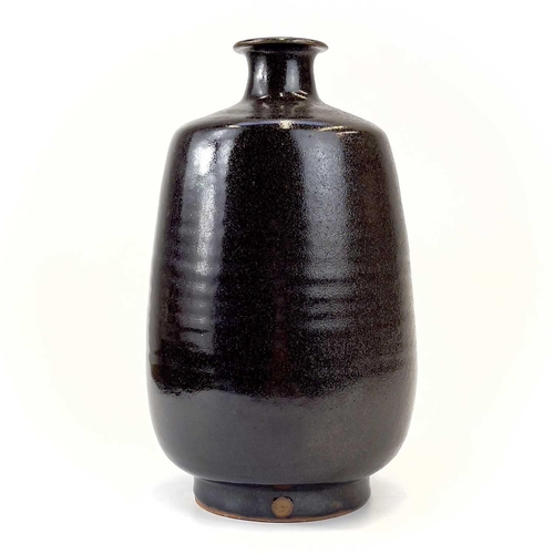 939 - A Jacob Bodilly studio pottery vase. With a tenmoku glaze, applied seal mark, height 29cm.