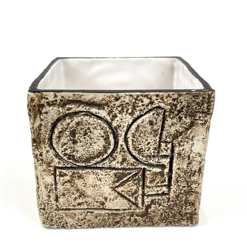 948 - A Troika pottery cube vase. With typical incised and painted geometric shapes, height 8.5cm.