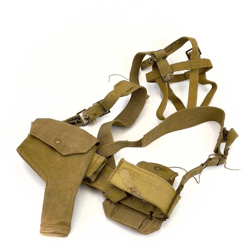 95 - A WWII British No.4 III gas mask. Together with a steel helmet and WWII webbing belt and harness.