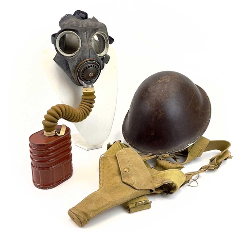 95 - A WWII British No.4 III gas mask. Together with a steel helmet and WWII webbing belt and harness.