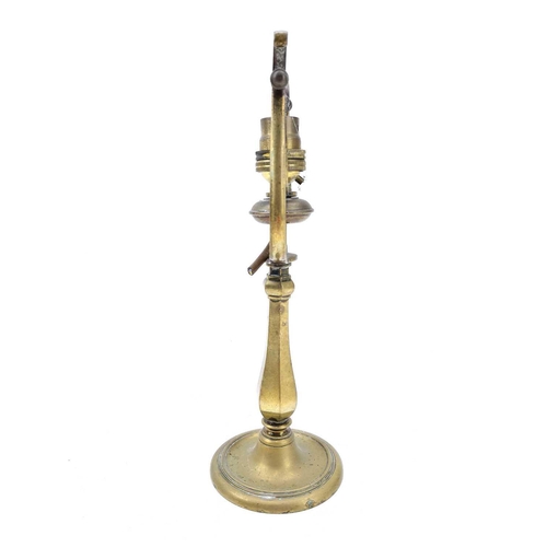 99 - A ships brass wall mounted gimbal lamp. Length 27cm.