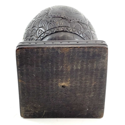 1 - A carved coconut box and cover. Circa 1800, the cover with a mustachioed male mask knop, the main bo... 