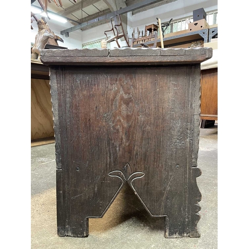 10 - A 17th century boarded oak coffer, probably West Country. The plank top and sides with scalloped edg... 