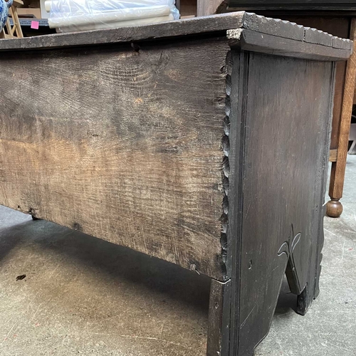 10 - A 17th century boarded oak coffer, probably West Country. The plank top and sides with scalloped edg... 