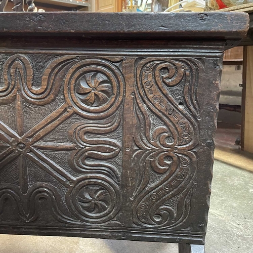 10 - A 17th century boarded oak coffer, probably West Country. The plank top and sides with scalloped edg... 