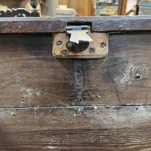 10 - A 17th century boarded oak coffer, probably West Country. The plank top and sides with scalloped edg... 