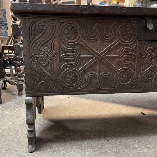 10 - A 17th century boarded oak coffer, probably West Country. The plank top and sides with scalloped edg... 