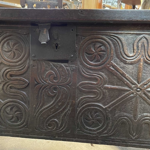 10 - A 17th century boarded oak coffer, probably West Country. The plank top and sides with scalloped edg... 