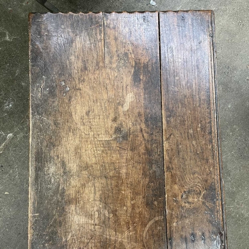 10 - A 17th century boarded oak coffer, probably West Country. The plank top and sides with scalloped edg... 