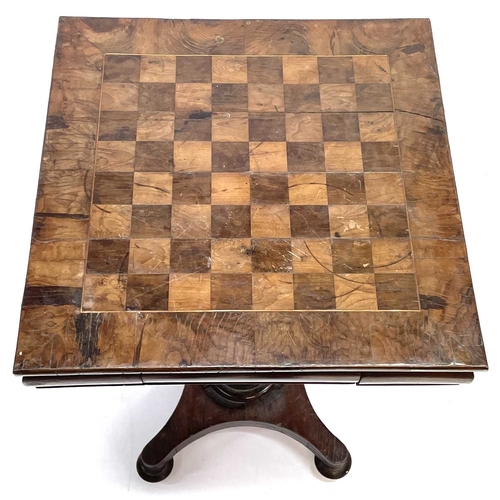 14 - An early Victorian yew wood pedestal chess table. The square crossbanded top with chequer inlay and ... 