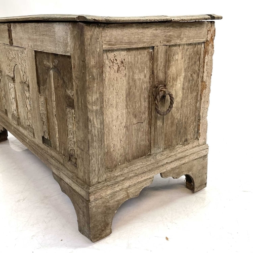 16 - An 18th century oak coffer. The three panel front with applied arched mouldings, height 62cm width 1... 