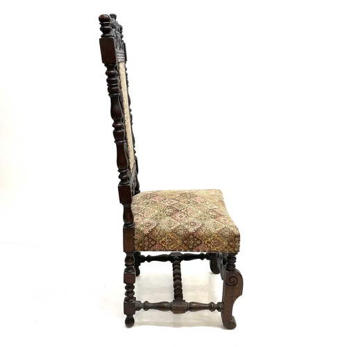 17 - A 17th century style oak side chair. Circa 1900, with scroll carved and pierced top rail and turned ... 