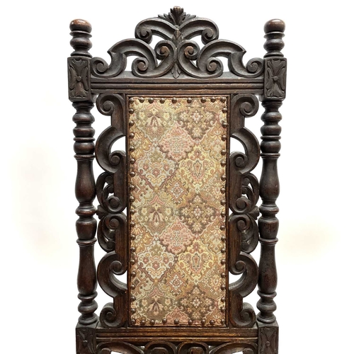 17 - A 17th century style oak side chair. Circa 1900, with scroll carved and pierced top rail and turned ... 