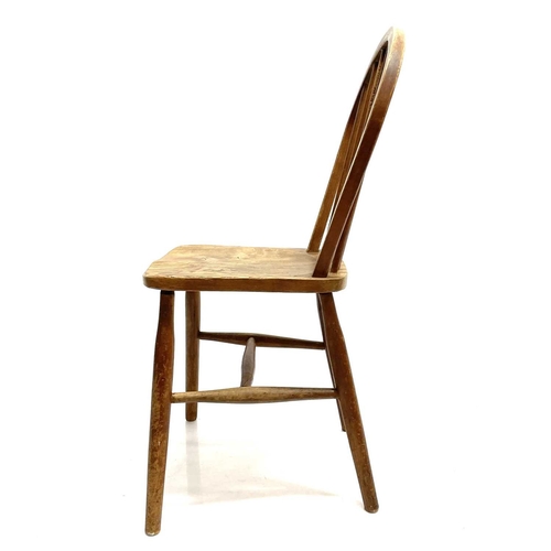 19 - A set of six ash, beech and elm Utility chairs. With hooped stick backs and turned legs (6).