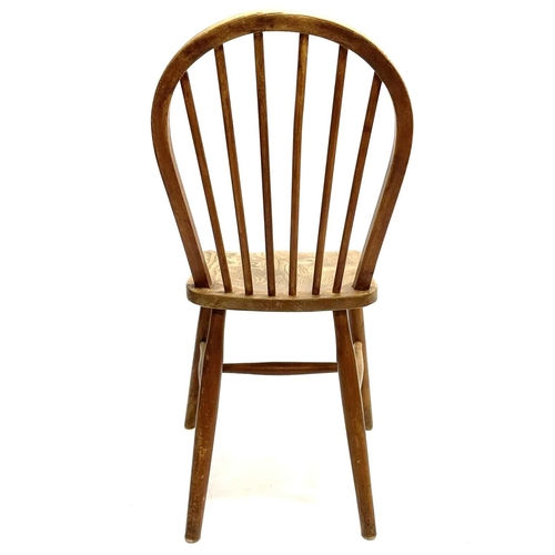 19 - A set of six ash, beech and elm Utility chairs. With hooped stick backs and turned legs (6).