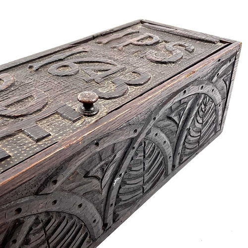 21 - An oak candle box. 19th century, the earlier panel door dated 1643 and initialled IPS RPE, height 51... 