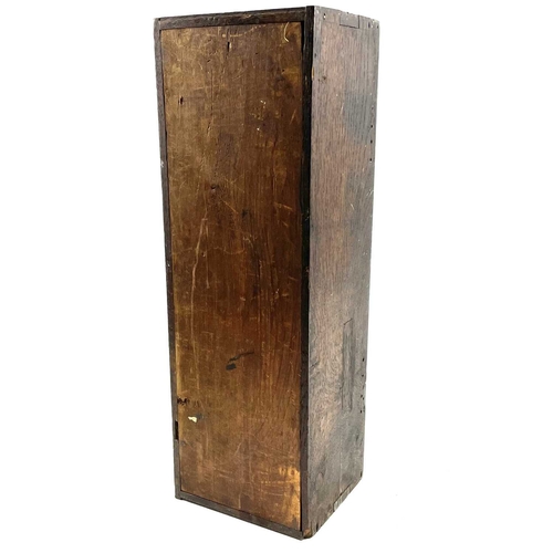 21 - An oak candle box. 19th century, the earlier panel door dated 1643 and initialled IPS RPE, height 51... 