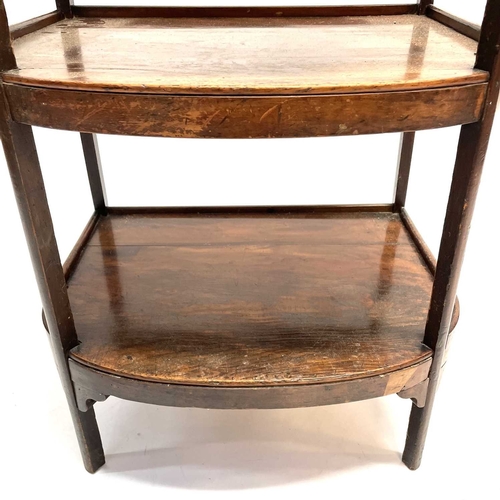 26 - A fruitwood D-shaped three tier whatnot. Mid 19th century, with slightly raised galleries and square... 