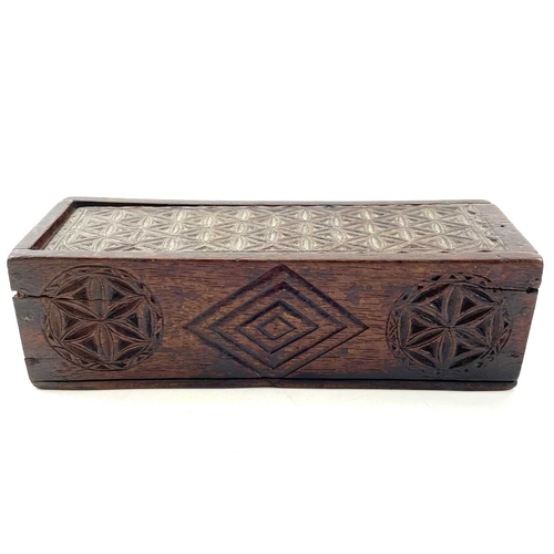 8 - An oak chip carved pencil box. Circa 1820, with sliding lid, length 19.5cm, together with a framed b... 