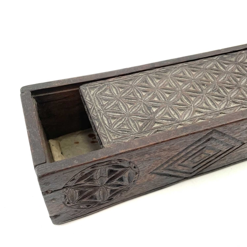 8 - An oak chip carved pencil box. Circa 1820, with sliding lid, length 19.5cm, together with a framed b... 