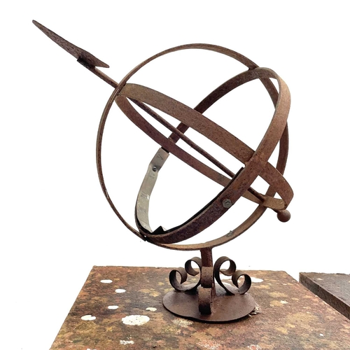 39 - A pair of wrought iron and brass mounted armillary spheres. Raised on reconstituted stone bases,. he... 