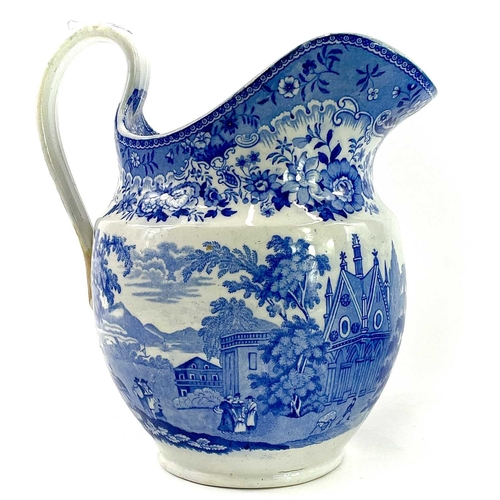 45 - A blue and white Chinoiserie printed porcellanous jug, With lion mask spout, circa 1840, height 15.5... 